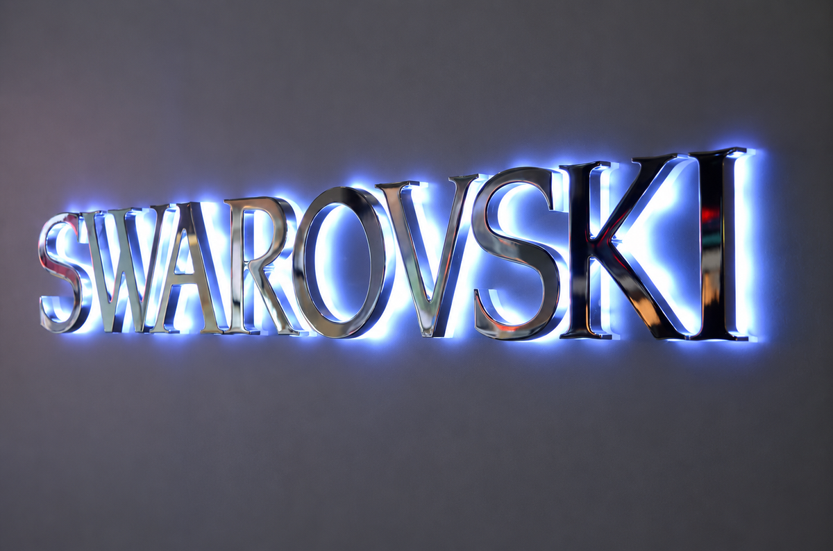 Custom backlit company logo with a soft white halo effect