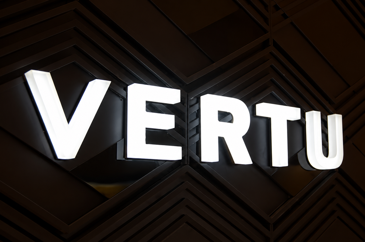 Fully illuminated business letters glowing above a modern storefront